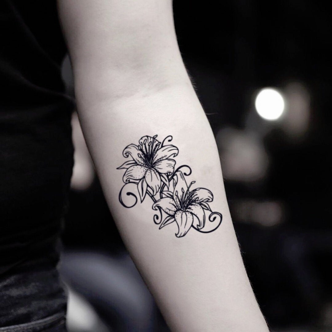 Simple yet elegant Lily tattoo... - The Blvckink Tattoos | Facebook