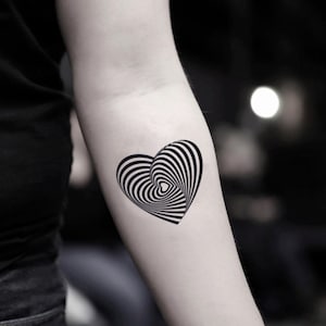 May include: A black and white optical illusion tattoo design of a heart with swirling lines.