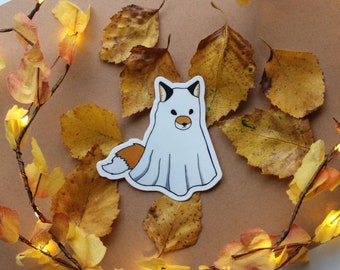 May include: A white ghost with a brown and orange fox tail, on a brown background with yellow leaves.