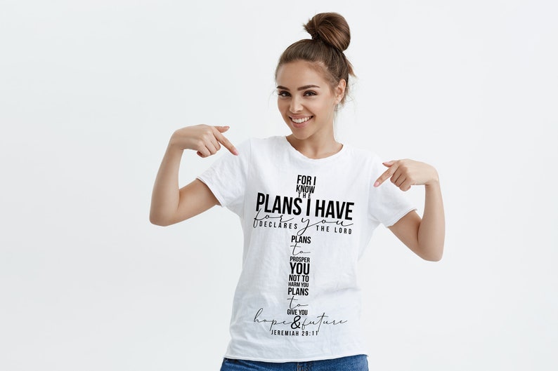 May include: White t-shirt with a black graphic print that reads "For I know the plans I have for you, declares the Lord, plans to prosper you and not to harm you, plans to give you hope and a future." Jeremiah 29:11