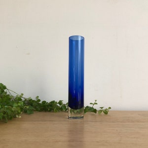 Bergdala Sweden cylinder vase, soliflore, in transparent petrol blue glass with clear base.