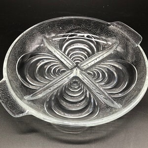 Glass round mussel dish, compartment dish, serving dish, snack dish, in clear textured, ribbed glass with shell design and handles.