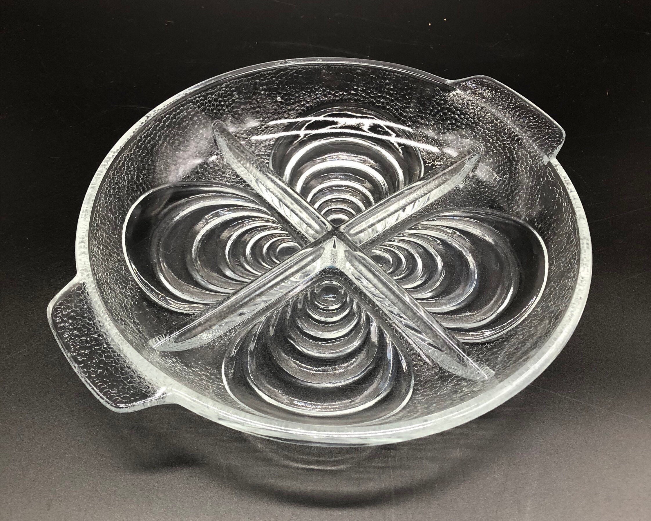 Glass round mussel dish, compartment dish, serving dish, snack dish, in clear textured, ribbed glass with shell design and handles.