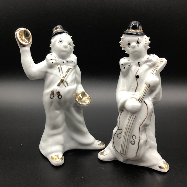 white porcelain pier rock, clowns, circus clowns, musicians, sad faces, with gold decorations. Cello and cymbals. MCM. set of 2
