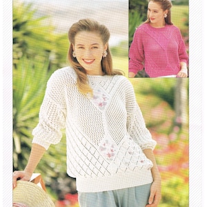 May include: Two women wearing white and pink sweaters with a diamond pattern. The sweaters are made with a double knitting technique. The text "JAEGER HANDKNITTING INTERNATIONAL" and "DOUBLE KNITTING" is visible on the image. The image also includes the text "PBN D6452 76-102cm 30-40in".