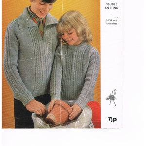 May include: Image of a vintage knitting pattern featuring two children wearing matching light gray sweaters. The pattern is for double knitting and chest sizes 24-34 inches. The Emu logo is visible.
