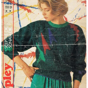 May include: A vintage knitwear pattern featuring a woman wearing a green sweater with red, blue, and green geometric accents. The pattern includes sizes 32-38 inches (81-97 cm). The brand name "Copley" is visible on the left side.