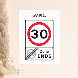May include: A white card with a road sign design. The sign features a red circle with the number 30 in black, and the words "Zone ENDS". The word "NAME," is written at the top.