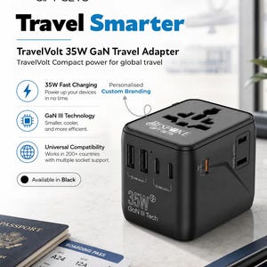 May include: A black TravelVolt 35W GaN travel adapter featuring multiple USB-A and USB-C ports, universal socket compatibility, and the text Bespoke Gift Sets, 35W GaN III Tech, and USA/JP Socket printed on the device exterior.