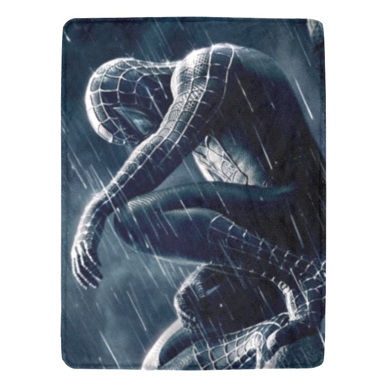 May include: A black and blue superhero character in a crouching pose, with a dark background and rain falling. The character is wearing a black suit with a web pattern.