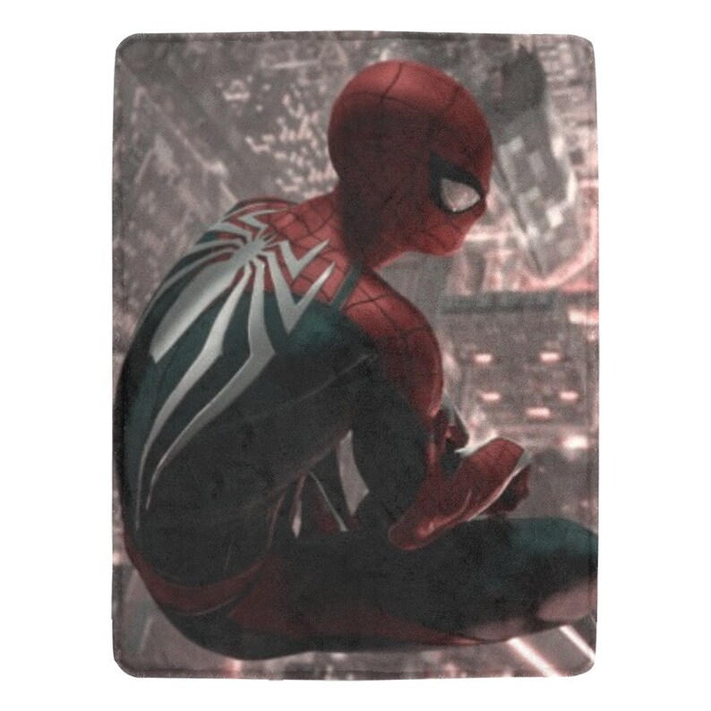 May include: A red and black superhero figure with a white spider design on the back, sitting on a building rooftop with a city skyline in the background.