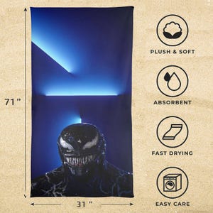 May include: A black and blue beach towel featuring a graphic of Venom. The towel is 71 inches long and 31 inches wide. The towel is plush and soft, absorbent, fast drying, and easy care.