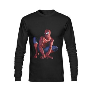 May include: Black long-sleeve t-shirt with a red and blue Spiderman graphic. The superhero is crouched in a fighting pose.
