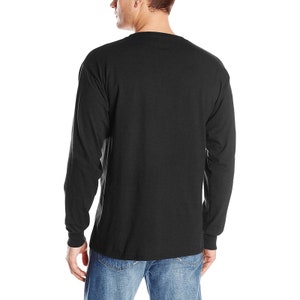 May include: A black long-sleeved t-shirt with a crew neck.