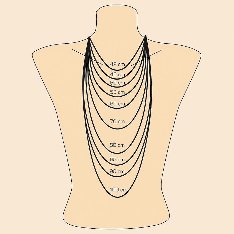 May include: A beige mannequin back displays a selection of necklaces, each with a different length. The lengths are labeled in centimeters, ranging from 42 cm to 100 cm, providing a visual guide for necklace sizing.
