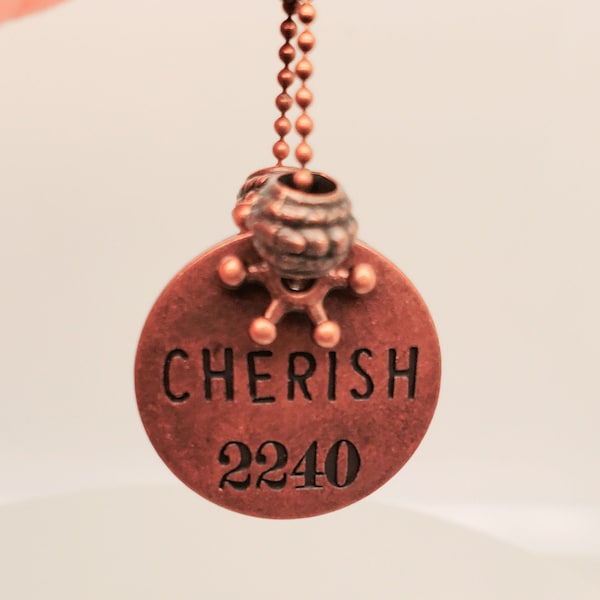 Cherish Medallion Pendant in antique copper, back is flat, star spacers and large-hole beads decorate the bail, ball chain