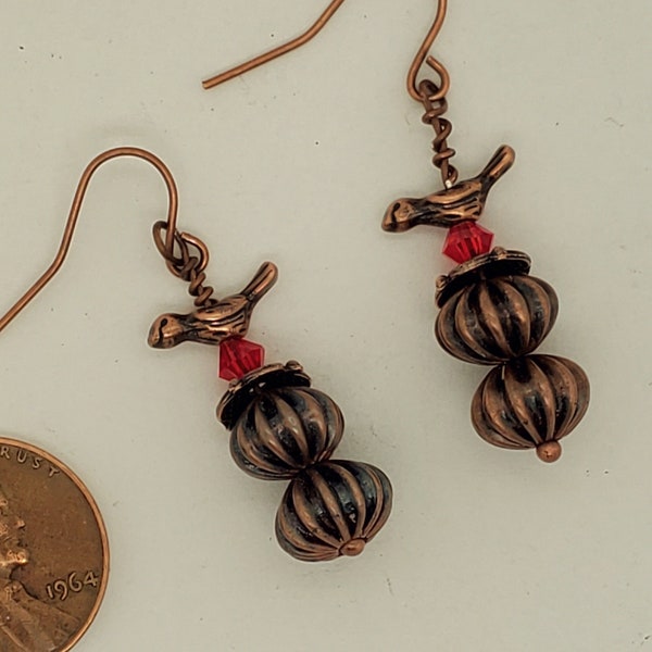 Fluted Bead & Bird Earrings, antique copper, small bird atop a red Swarovski crystal bicone, beadcap and 2 fluted metal beads, ear wires