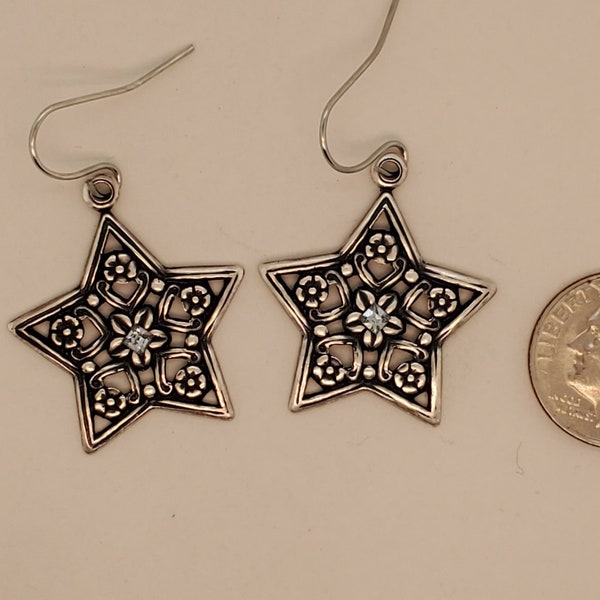 Flower Star Earrings are 5-pointed metal stampings in antique silver tone, flowers everywhere, pale blue square crystal center, ear wires