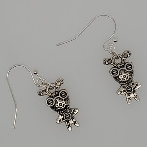 Gearhead silver alien earrings