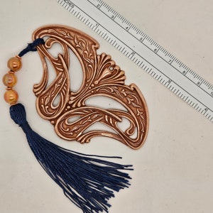 Gorgeous Bookmark, antique copper finish, Art nouveau style, 3 and 3/8 inches long, navy blue tassel, ceramic beige beads, copper spacers