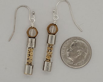 Steampunk Fuse Earrings, glass cylinder filled with little brass watch parts, silver tone ends, hexagonal brass ring above, ear wires