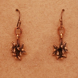 Blossom Antique Bronze Earrings, small stem holds 3 blossoms with 4 petals, antique copper jump ring and ear wires