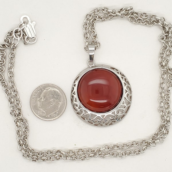 Silver Tone Pendant Necklace, lacy lower rim, burnt orange domed cab, rolo chain, lobster clasp in silver finish