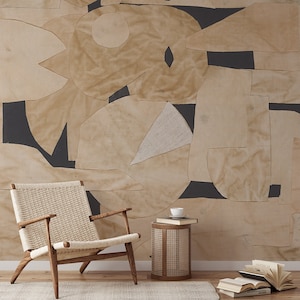 Chic, self-adhesive mural wallpaper featuring irregular beige geometric figures on a dark background, suitable for a quick room transformation.
