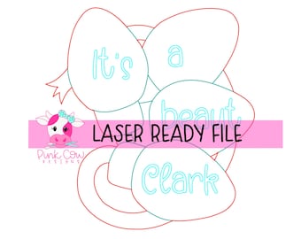May include: A digital laser ready file featuring a red outline of Christmas light bulbs with the text It's a beaut Clark in light blue. A pink horizontal banner across the center reads LASER READY FILE with a small pink cow logo on the left.