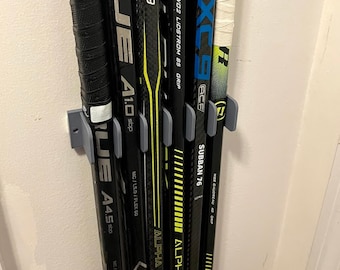 Organizador de palos de hockey para montar en la pared
