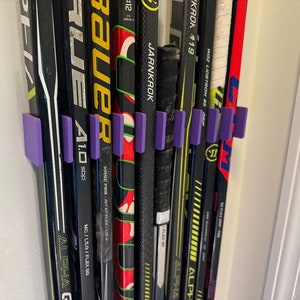 Soporte para palos de hockey de pared para 10 palos