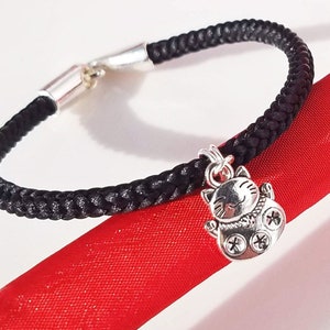 Chinese Bracelet with Tiger Charm: Hand-woven black satin thread square braid with silver &quot;Tiger&quot; lucky cat charm and silver hook clasp