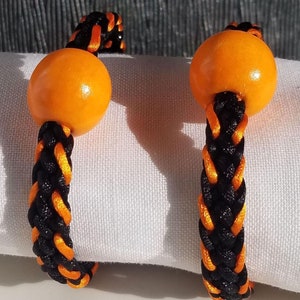 Halloween party napkin rings, hand-woven mix of threads in festive orange & black with an orange wooden round accent bead, set of 2, 4 or 6.