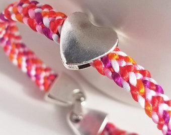 LGBTQ Pride bracelet in lesbian flag color mix, hand-woven satin flat braid with a silver heart bead and snap-clip clasp, 7 sizes available!