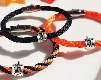 Halloween Pumpkin Bracelet: Hand-woven satin thread in black, orange or black/orange mix with a silver pumpkin bead and magnetic/pin clasp.