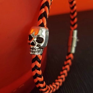 Halloween Party Bracelet: Hand-woven satin thread square braid in black, orange or mixed with a silver skull bead and silver magnetic clasp.