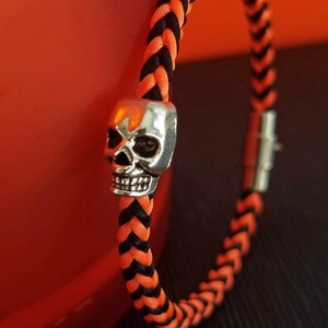 Skull Bracelets for Halloween, hand-woven square braid in black, orange or mixed with a silver scary skull bead and matching magnetic clasp.