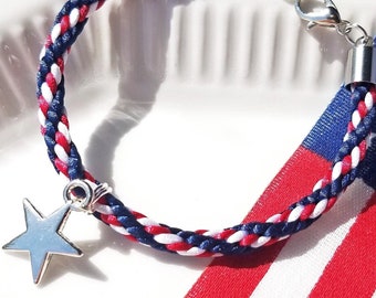 4th of July Bracelet in American Flag colors: hand-braided satin thread in red white and blue with a silver star charm and adjustable clasp.