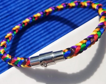 Pride Month Celebration Bracelet: Hand-woven satin thread square braid in LGBTQ Pride flag colors with a silver magnetic-pin accent clasp.