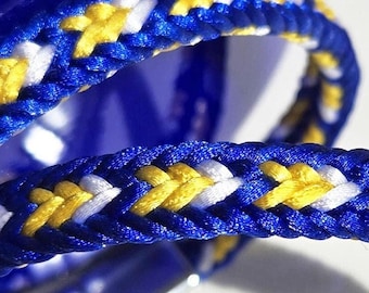 Pulsera Rams: Trenza de satén tejida, colores de Los Ángeles, cierre magnético.