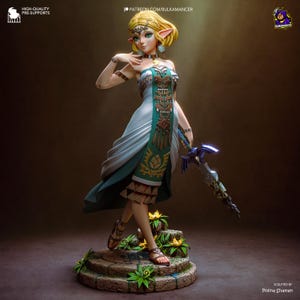 May include: A detailed figurine of a character from The Legend of Zelda. The figure is blonde with pointed ears, wearing a white and teal dress with gold accents, and holding a glowing blue sword. The figure stands on a stone base with flowers.