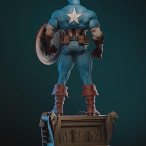 May include: A detailed statue of Captain America, viewed from the back, showcasing his iconic blue and white costume with a star emblem. He holds his shield and stands on a decorative base. The statue is labeled as 1/6 scale.