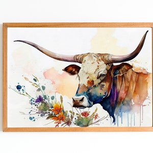 May include: Watercolor painting of a brown and white Texas Longhorn steer with large horns, looking to the left. The steer is surrounded by a watercolor background of flowers and foliage in shades of blue, purple, orange, and green.