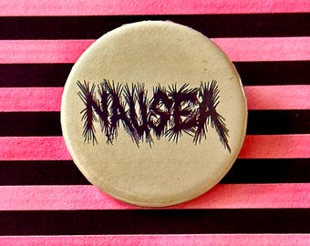 NAUSEA-Pin Badge in 38mm/58mm off white/black