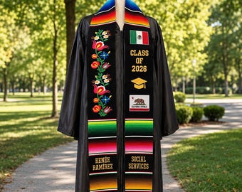 May include: A black graduation gown with a colorful embroidered sash. The sash features floral designs, the Mexican flag, and the text "CLASS OF 2026". The sash also includes the text "RENÉE RAMIREZ" and "SOCIAL SERVICES".