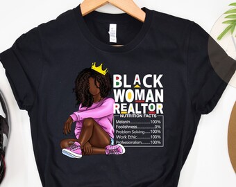 May include: Black t-shirt with a graphic of a Black woman wearing a crown and pink shirt. The text "Black Woman Realtor" and "Nutrition Facts" are printed on the shirt. The graphic includes a list of qualities with percentages.