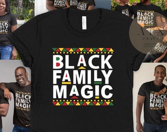 May include: Black t-shirt with the text "Black Family Magic" in white letters with a colorful geometric pattern behind the text. The shirt is shown on multiple people of different ages and genders.