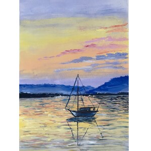 May include: Acrylic painting of a sailboat at sunset. The sky is a blend of yellow, pink, and purple, with the boat's reflection in the water. Mountains are visible in the background, creating a serene landscape.
