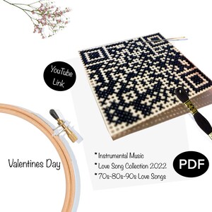 May include: A cross-stitch pattern featuring a black and white QR code. The pattern is displayed on a white background with a wooden embroidery hoop, black embroidery floss, and a needle. The text "Valentines Day" is visible below the hoop. The text "Instrumental Music", "Love Song Collection 2022", and "70s-80s-90s Love Songs" is visible below the pattern. The text "PDF" is visible in a black circle.