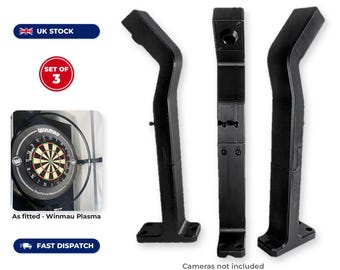 May include: A set of three black 3D printed camera arms for Winmau Plasma dartboard lighting systems. The mounts are compatible with OV9732, OV2710, and IMX179 cameras, featuring integrated cable channels and included mounting screws.